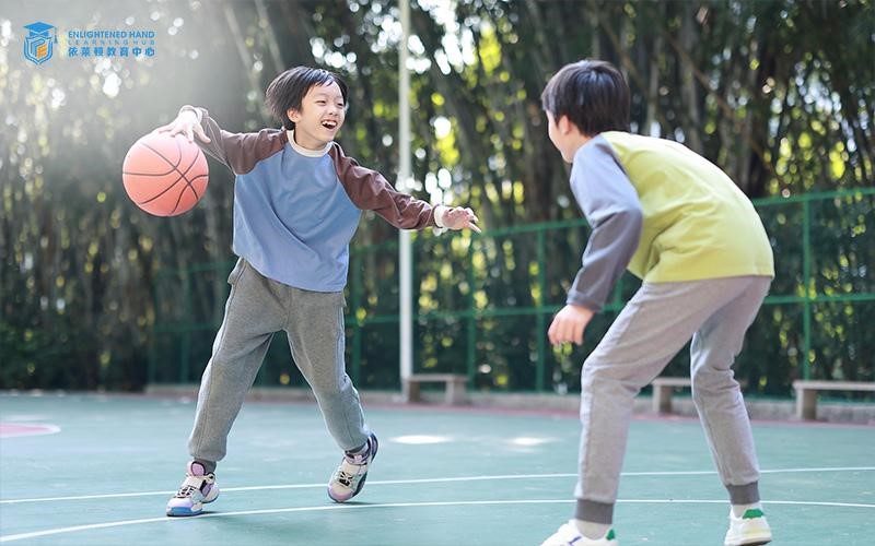 Students playing basketball outdoors