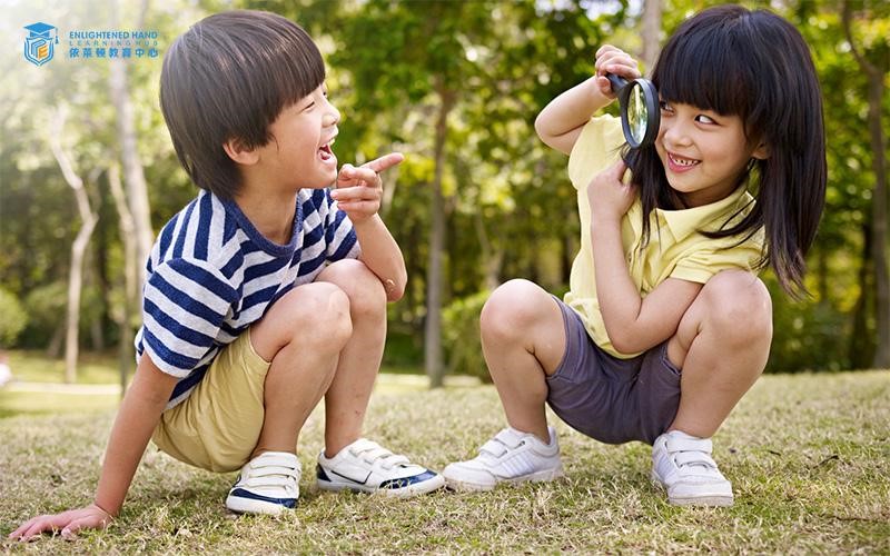 2 Students playing outdoors